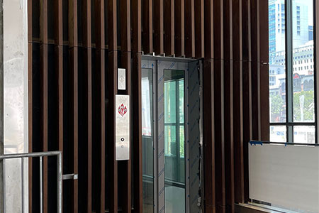 14,000lft of dassoXTR Bamboo Epic Cognac 2x6 Lumber featured as decorative Vertical Wall Fins