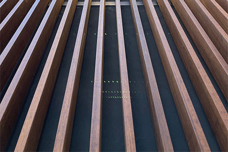 14,000lft of dassoXTR Bamboo Epic Cognac 2x6 Lumber featured as decorative Vertical Wall Fins